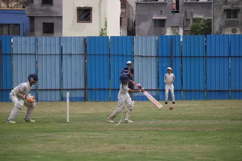 Cricket being played on a community ground in India