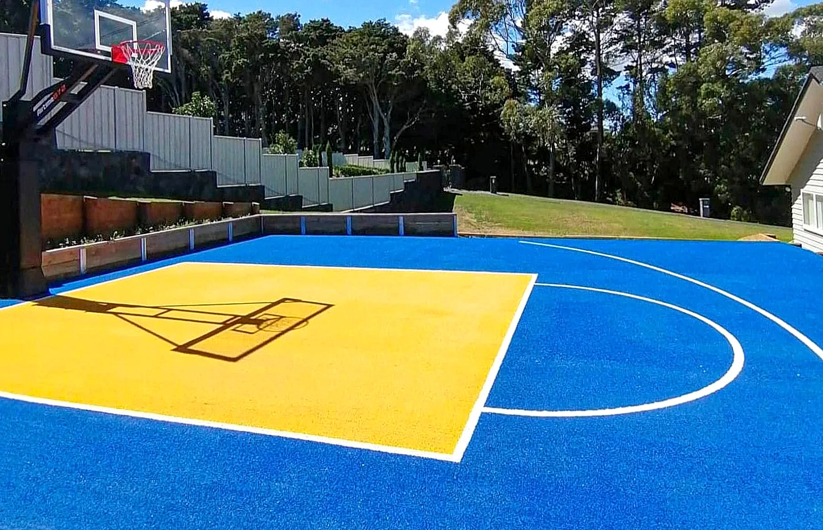 Synthetic acrylic sports flooring surface